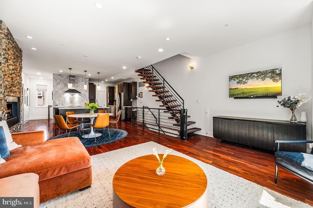 living room with dark hardwood / wood-style flooring