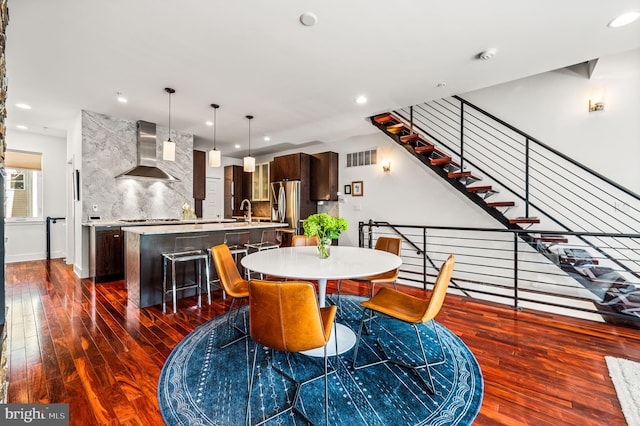 dining area with dark hardwood / wood-style flooring and sink