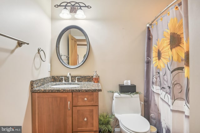 bathroom with vanity, toilet, and a shower with shower curtain