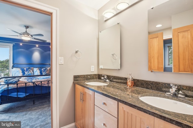 bathroom featuring ceiling fan and vanity