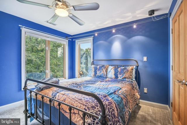 carpeted bedroom with ceiling fan