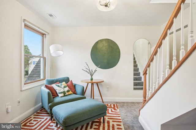 living area featuring carpet floors