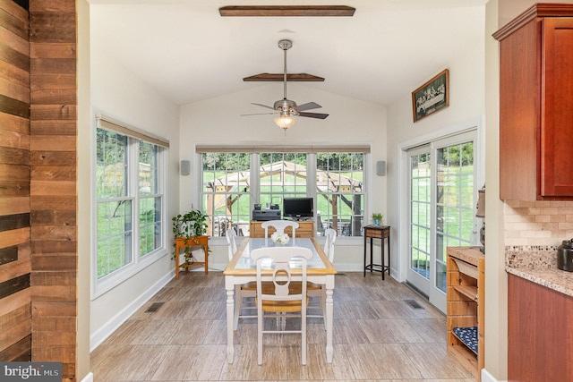 sunroom with lofted ceiling and ceiling fan