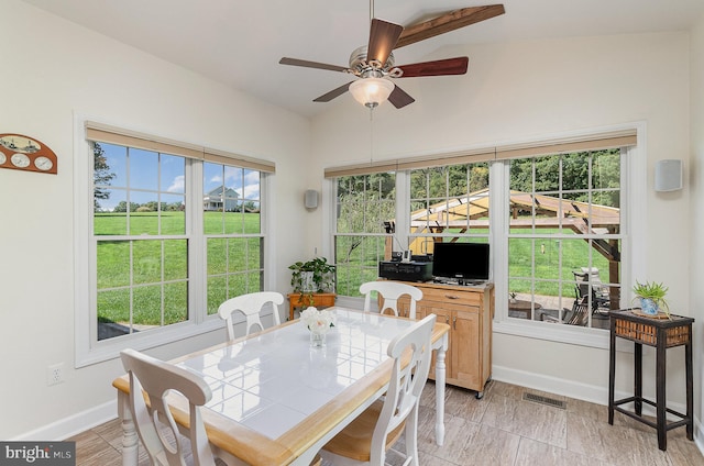 dining room with lofted ceiling and ceiling fan