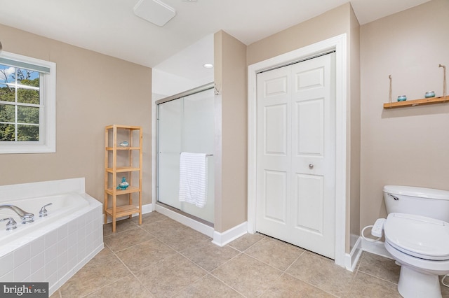 bathroom featuring toilet, tile patterned flooring, and plus walk in shower