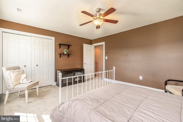 bedroom with carpet, a closet, and ceiling fan