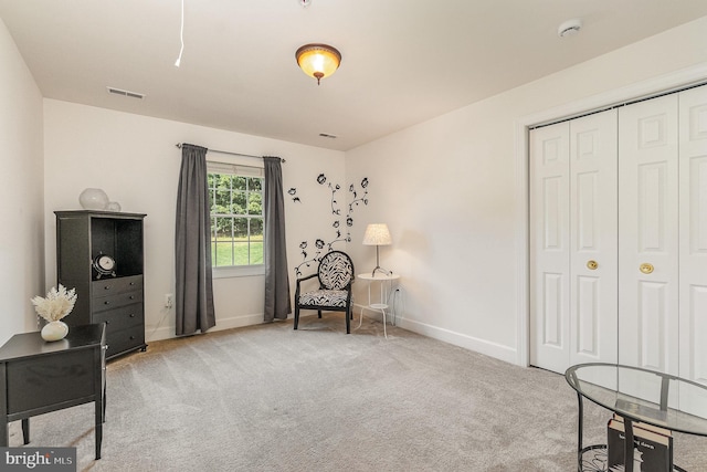 sitting room with light carpet