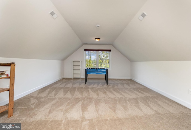 additional living space with lofted ceiling and light colored carpet