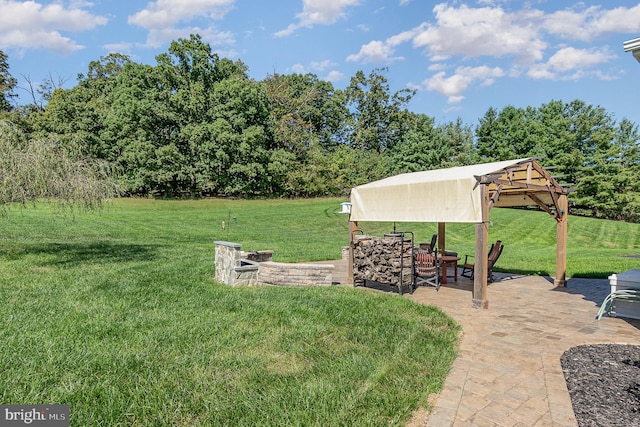 view of yard featuring a gazebo and a patio