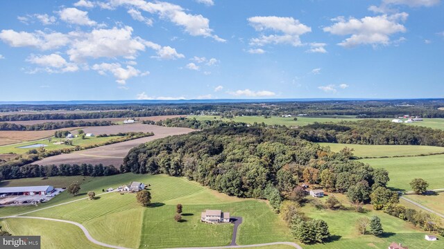 birds eye view of property with a rural view