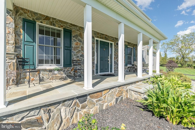 entrance to property featuring a porch