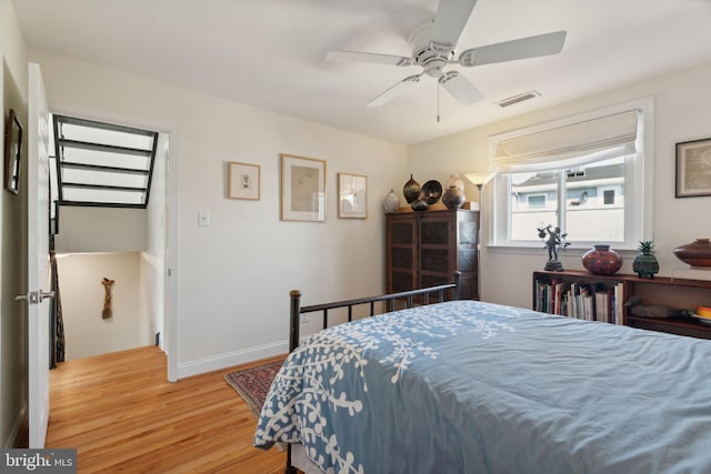 bedroom with wood-type flooring and ceiling fan