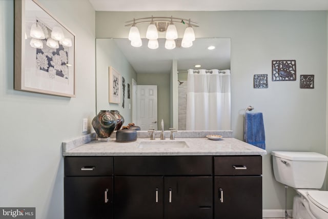 bathroom with toilet and vanity