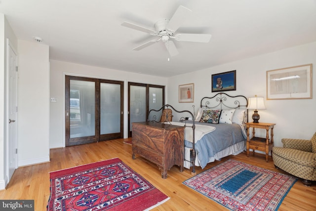 bedroom featuring ceiling fan and wood-type flooring