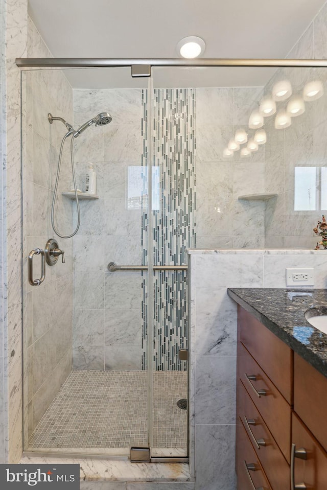 bathroom with vanity and an enclosed shower