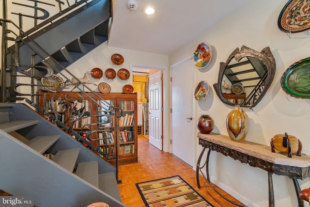 entryway featuring parquet floors