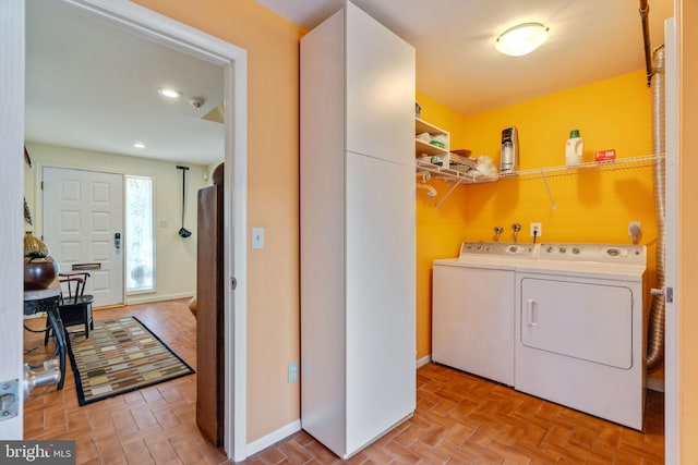 laundry room with washing machine and clothes dryer