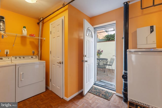 washroom featuring washing machine and dryer