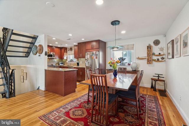 dining room featuring light wood-type flooring