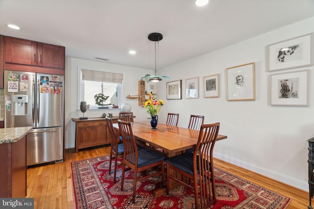 dining space featuring light hardwood / wood-style flooring