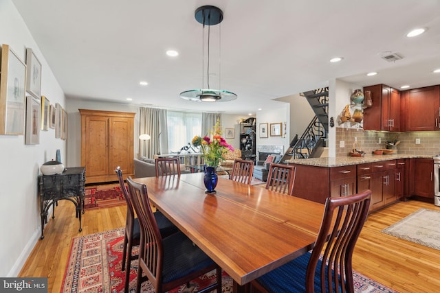 dining room with light wood-type flooring