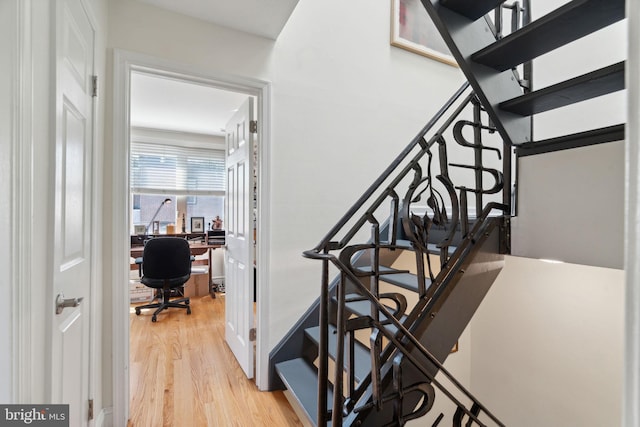 staircase featuring wood-type flooring