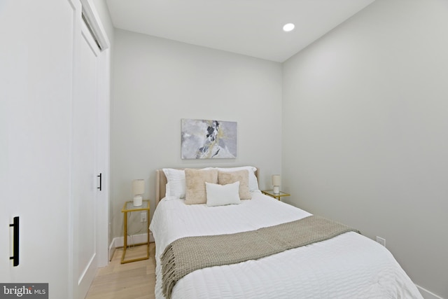 bedroom with light wood-type flooring