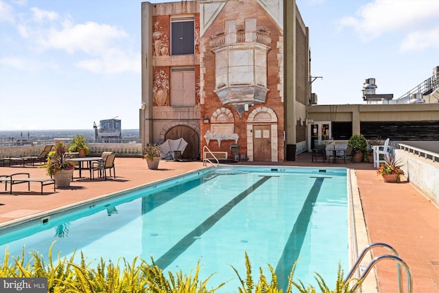 view of swimming pool with a patio area