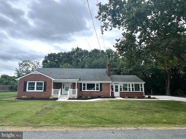 ranch-style home with a front yard