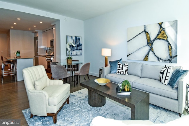 living room featuring dark wood-type flooring