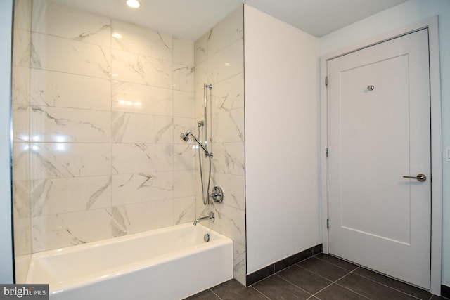 bathroom featuring tiled shower / bath and tile patterned flooring