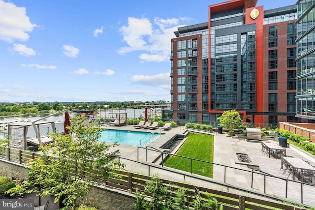 view of swimming pool with a patio area