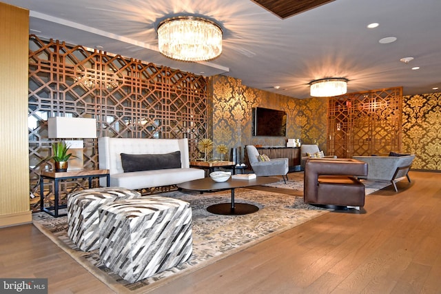 living room with hardwood / wood-style flooring and a chandelier