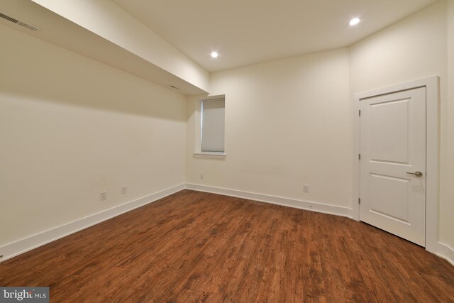 unfurnished room featuring dark hardwood / wood-style flooring