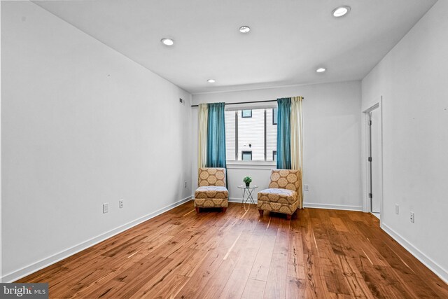 unfurnished room featuring hardwood / wood-style flooring