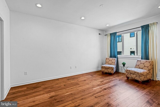 sitting room featuring hardwood / wood-style flooring