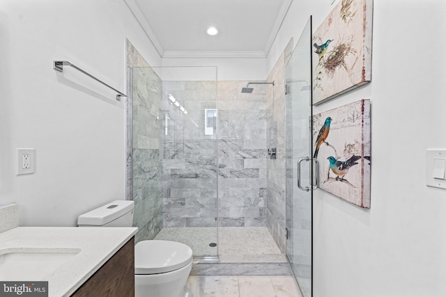 bathroom featuring a shower with door, crown molding, vanity, and toilet