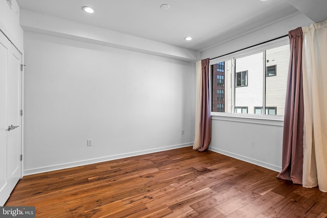 unfurnished room featuring wood-type flooring