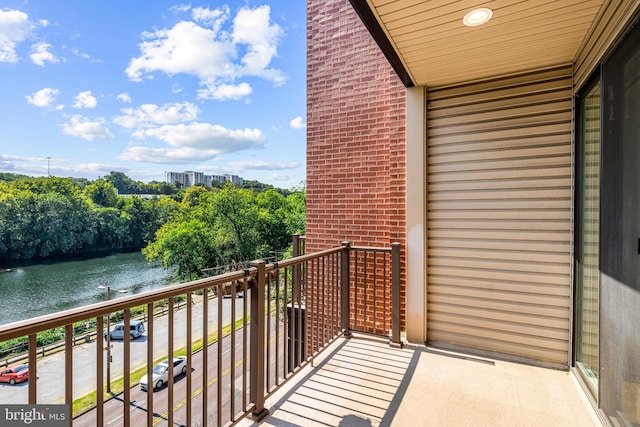 balcony featuring a water view