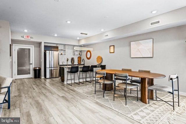 dining room with light wood-type flooring