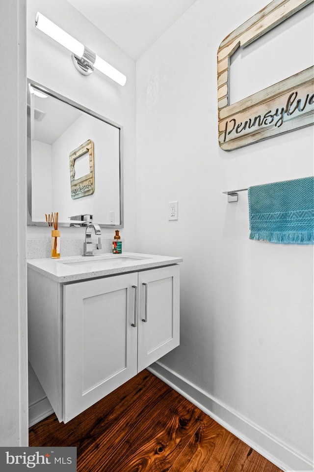 bathroom featuring hardwood / wood-style flooring and vanity