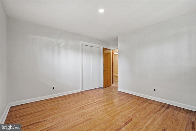 spare room featuring light hardwood / wood-style floors