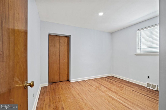 empty room featuring hardwood / wood-style flooring