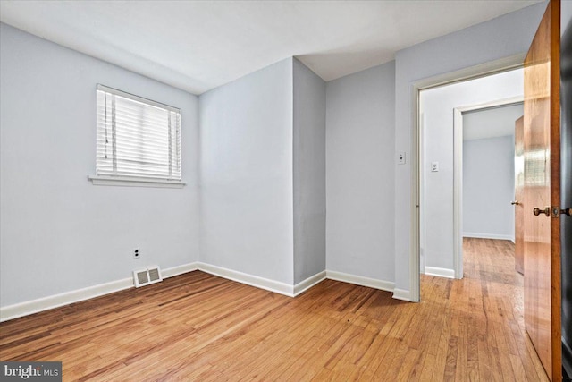 unfurnished room featuring light hardwood / wood-style flooring