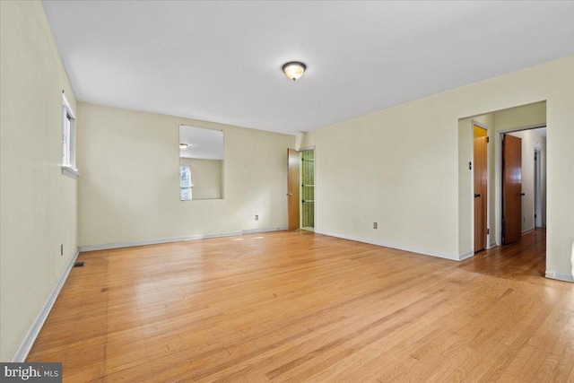 unfurnished room featuring light hardwood / wood-style flooring