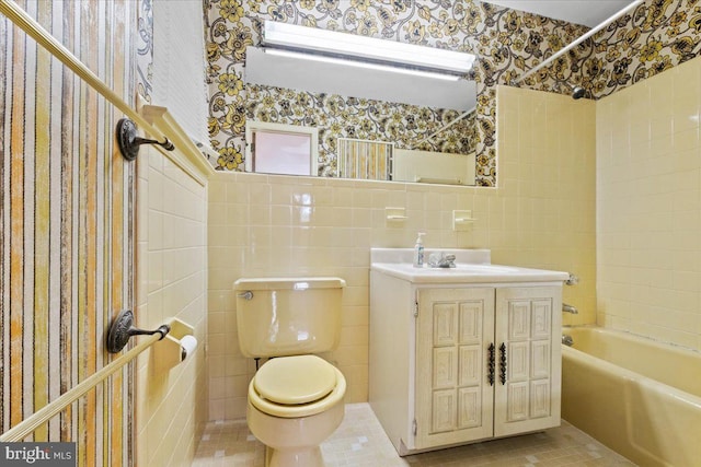 full bathroom with tile patterned flooring, vanity, toilet, and tile walls