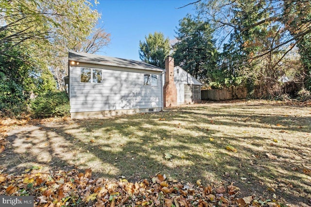 view of home's exterior with a lawn