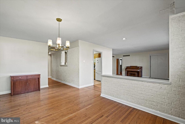 interior space featuring a chandelier and hardwood / wood-style flooring