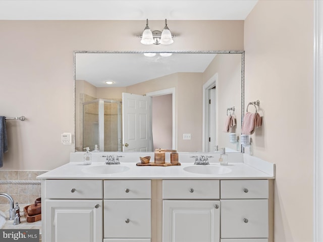 bathroom with vanity and an enclosed shower