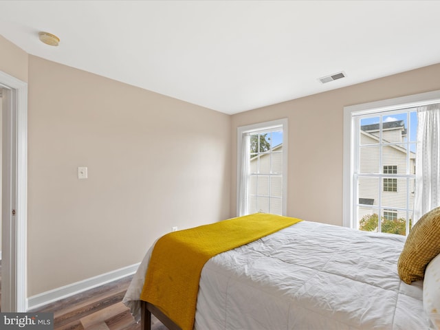 bedroom with hardwood / wood-style flooring